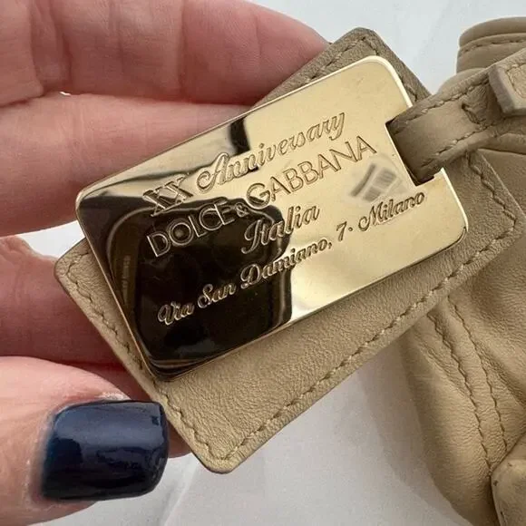 Dolce and Gabbana miniature leather bag with kiss lock, plaque and gold hardware